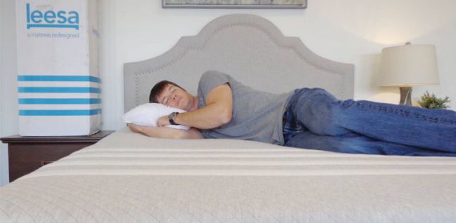 guy sleeping on leesa mattress