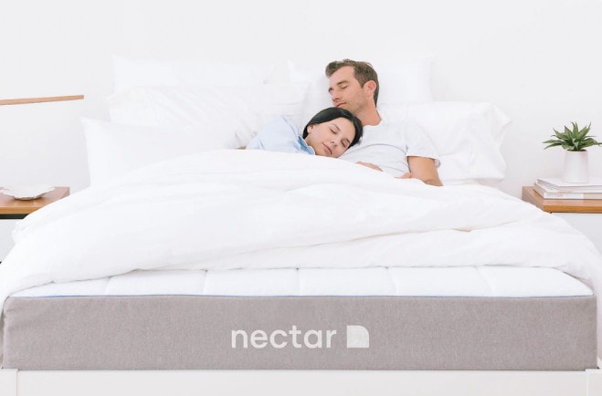 couple laying on nectar bed